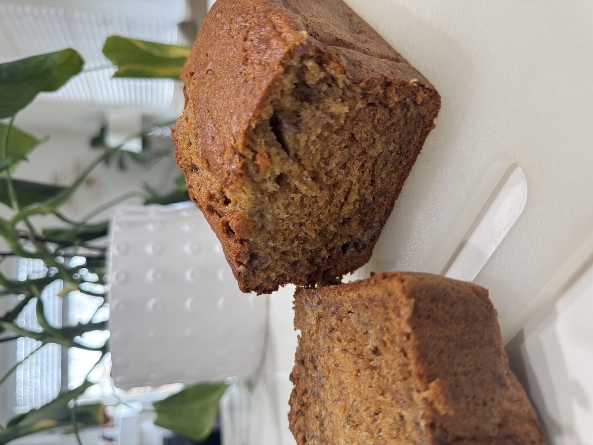 A loaf of Severance Baking Co. banana bread on a kitchen counter, sliced open to show the soft interior