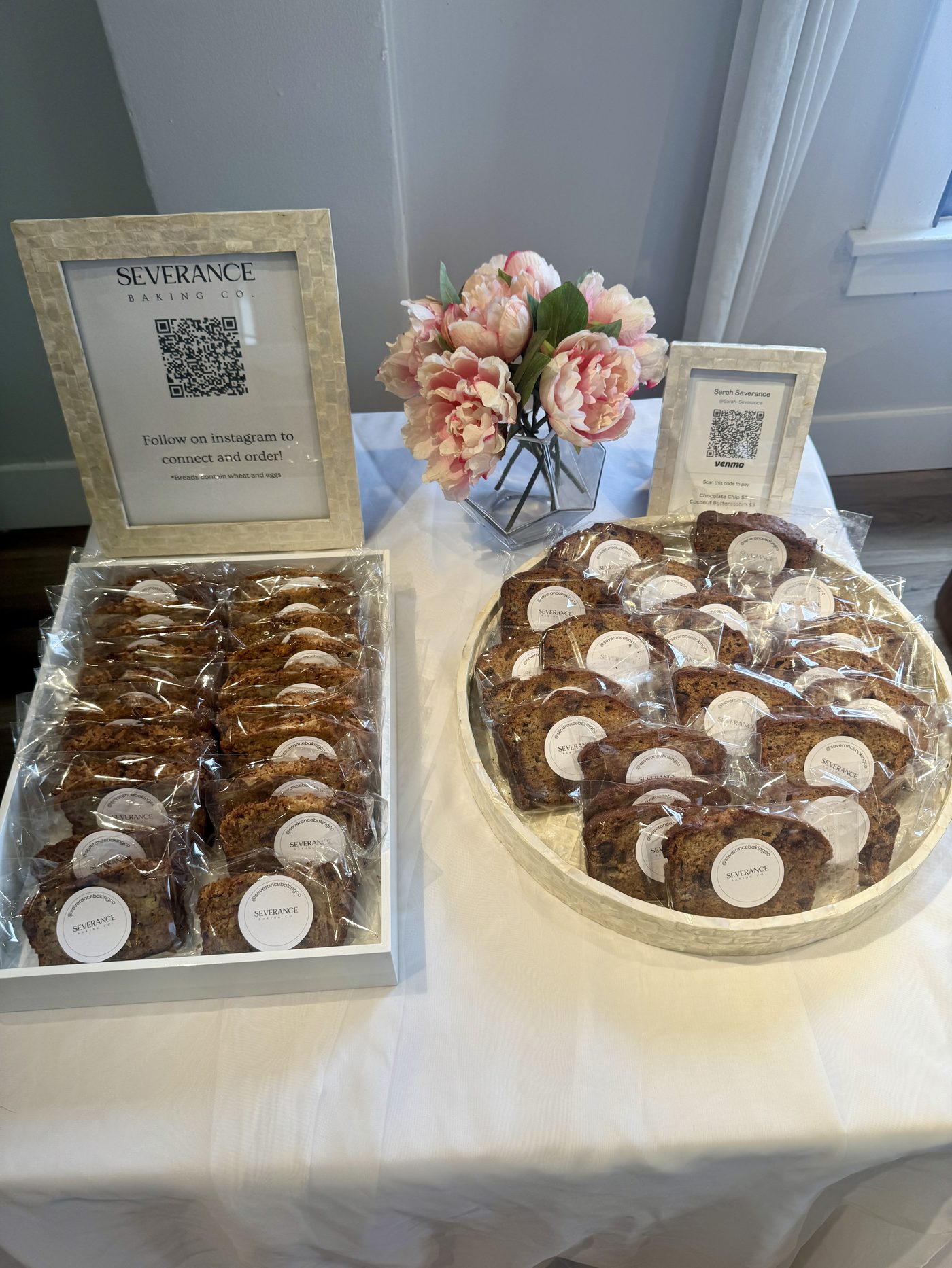 Severance Baking Co. pop-up table display with packaged banana bread slices and branded signage
